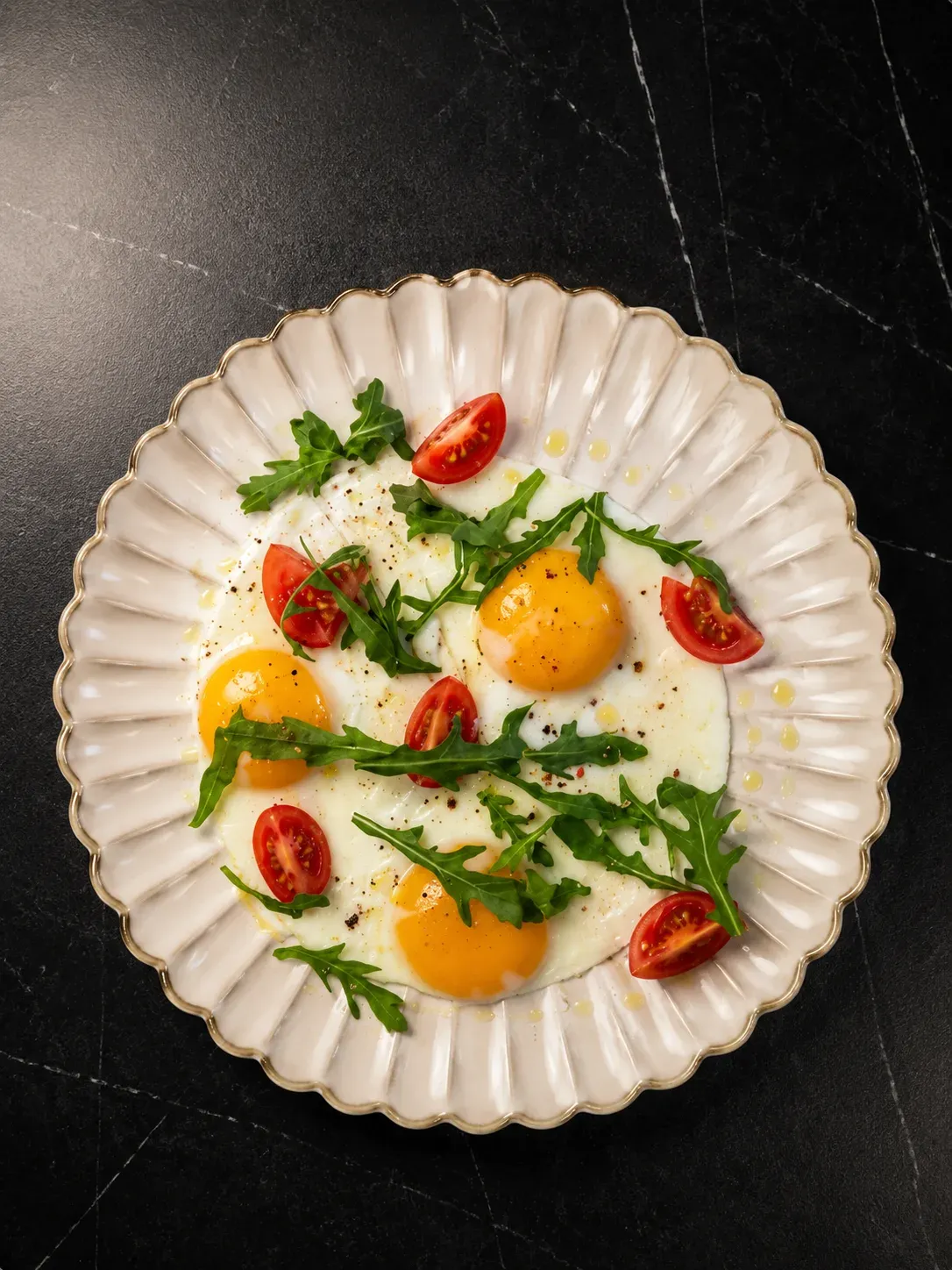 Three Fried Eggs with Tomatoes and Herbs